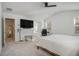 Bright bedroom with a sloped ceiling, and a large mounted TV creating a relaxing retreat at 4722 Blake Loop, Atlanta, GA 30349