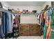 A large walk-in closet with shelving, hanging rods, and drawer space, perfect for organizing clothes and accessories at 4722 Blake Loop, Atlanta, GA 30349