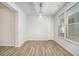 Bright dining room featuring wood floors, a modern light fixture, and natural light creating an inviting space at 4722 Blake Loop, Atlanta, GA 30349