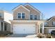 Charming two-story brick home with a two-car garage and well-maintained landscaping at 4722 Blake Loop, Atlanta, GA 30349