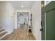 Open foyer with wood-look flooring and an entrance to the bright living space at 4722 Blake Loop, Atlanta, GA 30349
