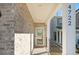 Inviting front porch with brick accents and decorative railing detail at 4722 Blake Loop, Atlanta, GA 30349