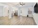 Open-concept living room with wood-look floors, flowing into a modern kitchen at 4722 Blake Loop, Atlanta, GA 30349