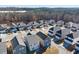 Overhead image displays modern homes in a well-planned neighborhood, each featuring driveways and a cohesive architectural design at 4722 Blake Loop, Atlanta, GA 30349