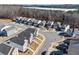From above, a residential area exhibits modern homes with individual driveways and well-kept lawns, nestled in a serene environment at 4722 Blake Loop, Atlanta, GA 30349