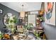 Bohemian living room with gallery wall, plants, and a cowhide rug at 500 Mariposa Ln, Mcdonough, GA 30253