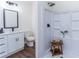Bathroom featuring modern vanity, black hardware, wood grain floors and glass enclosed shower at 109 Shirley Se Ln, Acworth, GA 30101