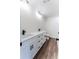 Modern bathroom featuring a double sink vanity with sleek black fixtures and wood-look flooring at 109 Shirley Se Ln, Acworth, GA 30101