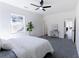 Bedroom with a ceiling fan, gray carpet, white walls, and a doorway to the hallway at 109 Shirley Se Ln, Acworth, GA 30101