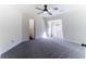 Bright bedroom with neutral gray carpeting, a ceiling fan, and a window providing natural light at 109 Shirley Se Ln, Acworth, GA 30101