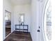 Bright foyer with hardwood floors, modern decor, and entry door at 109 Shirley Se Ln, Acworth, GA 30101