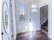 Bright foyer with hardwood floors, white trim, and a view to the staircase at 109 Shirley Se Ln, Acworth, GA 30101