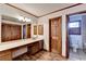 Bathroom with vanity, large mirror and tile flooring at 3898 Buckland Dr, Lilburn, GA 30047