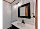 Updated bathroom with a vanity and mirror at 3898 Buckland Dr, Lilburn, GA 30047