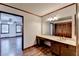 Bathroom boasts a vanity with a large mirror and wood cabinets at 3898 Buckland Dr, Lilburn, GA 30047