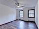 Well-lit bedroom, featuring wood floors and two windows at 3898 Buckland Dr, Lilburn, GA 30047