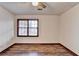 Spacious bedroom with wood flooring and large window at 3898 Buckland Dr, Lilburn, GA 30047