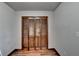 Wood paneled closet with bi-fold doors at 3898 Buckland Dr, Lilburn, GA 30047