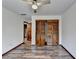 Bright bedroom with wood floors and large closet at 3898 Buckland Dr, Lilburn, GA 30047