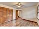 Charming bedroom with wood floors and built-in closet at 3898 Buckland Dr, Lilburn, GA 30047