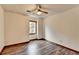 Simple bedroom with wood floors and a window at 3898 Buckland Dr, Lilburn, GA 30047