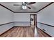 Spacious dining room with hardwood floors and a ceiling fan at 3898 Buckland Dr, Lilburn, GA 30047