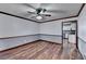 Dining room with hardwood floors and ceiling fan at 3898 Buckland Dr, Lilburn, GA 30047