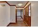 Hardwood floor entryway with wood door and view to living room at 3898 Buckland Dr, Lilburn, GA 30047
