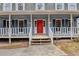 Front entry with steps leading to a red front door at 3898 Buckland Dr, Lilburn, GA 30047