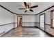 Gathering room with hardwood floors and sliding glass doors at 3898 Buckland Dr, Lilburn, GA 30047