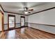 Spacious living room with hardwood floors and ceiling fan at 3898 Buckland Dr, Lilburn, GA 30047