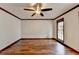 Light-filled living room with hardwood floors and window at 3898 Buckland Dr, Lilburn, GA 30047