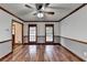 Bright living room featuring hardwood floors and large windows at 3898 Buckland Dr, Lilburn, GA 30047