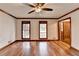 Hardwood floors and multiple windows in this living room at 3898 Buckland Dr, Lilburn, GA 30047