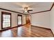 Living room features hardwood floors and a view to hallway at 3898 Buckland Dr, Lilburn, GA 30047
