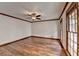 Living room boasts hardwood floors and a large window at 3898 Buckland Dr, Lilburn, GA 30047
