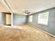 Spacious living room with neutral walls and carpet at 4363 Stonewall Tell Rd, Atlanta, GA 30349