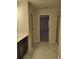 Bathroom with marble-look tile and a view into a bedroom at 4513 Eastbrook Pl, Snellville, GA 30039