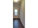 Bright entryway with wood-look flooring and white door at 4513 Eastbrook Pl, Snellville, GA 30039