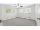 Spacious bedroom with grey carpet and ceiling fan at 558 Plainville Dr, Atlanta, GA 30331