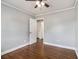 This bedroom offers hardwood floors, fresh paint, and a ceiling fan at 3453 Eisenhower E Cir, Atlanta, GA 30354