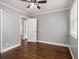 This bedroom has hardwood floors, fresh paint, window, and a ceiling fan at 3453 Eisenhower E Cir, Atlanta, GA 30354