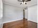 Bedroom with hardwood floors, a ceiling fan, neutral paint, and a window providing natural light at 3453 Eisenhower E Cir, Atlanta, GA 30354