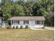 Single story home with a well manicured front yard at 3453 Eisenhower E Cir, Atlanta, GA 30354