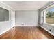 Light-filled living room with hardwood floors, neutral walls, and large windows providing ample light at 3453 Eisenhower E Cir, Atlanta, GA 30354