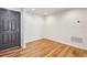 Inviting foyer with hardwood floors and neutral walls leads to various areas of the home at 23111 Plantation Ne Dr, Atlanta, GA 30324