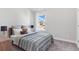 Bright bedroom with window and neutral-toned bedding at 475 Paces Dr, Lithia Springs, GA 30122