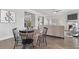 Dining area is connected to the living room, creating an open and inviting space for Gathering gatherings at 475 Paces Dr, Lithia Springs, GA 30122