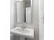 Simple bathroom with pedestal sink and framed mirror at 485 Paces Dr, Lithia Springs, GA 30122