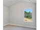 Simple bedroom with window and carpet flooring at 485 Paces Dr, Lithia Springs, GA 30122